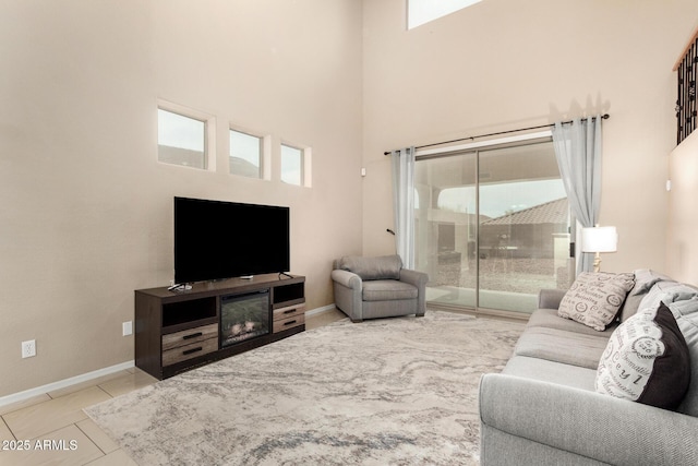 12023 W Duane Ln, Peoria, AZ 85383 - living room with a high ceiling and baseboards