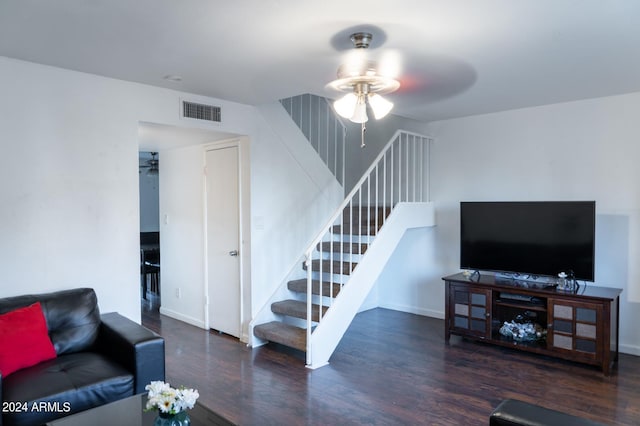 living room with ceiling fan and dark hardwood / wood-style floors