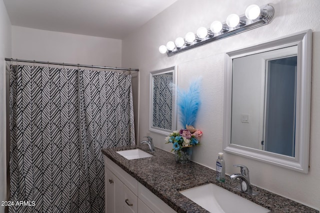 bathroom with vanity and walk in shower