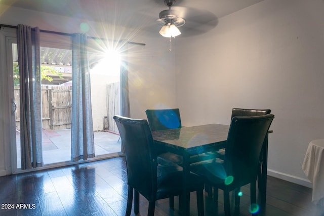 dining area with hardwood / wood-style flooring and ceiling fan