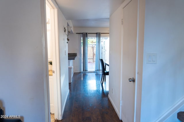 corridor featuring dark hardwood / wood-style floors