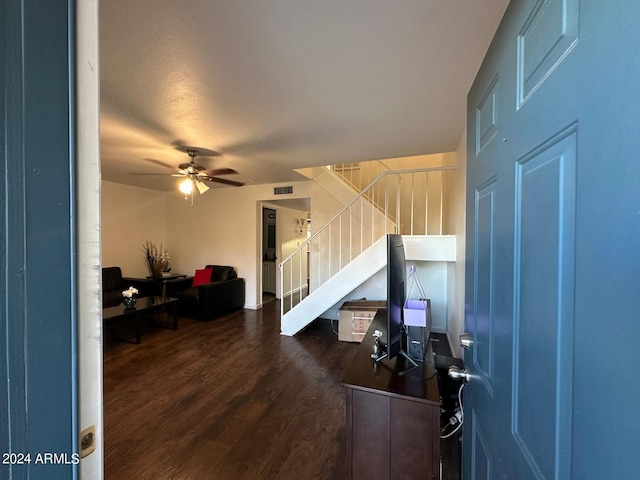 foyer with ceiling fan and dark hardwood / wood-style flooring