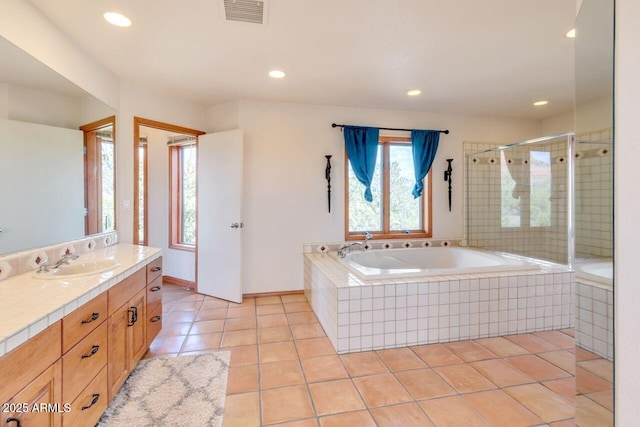 bathroom featuring visible vents, a garden tub, tile patterned flooring, vanity, and a shower stall