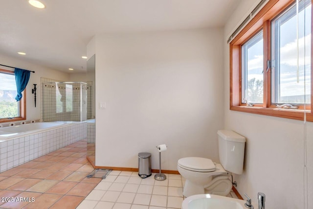 full bath featuring a garden tub, toilet, a shower stall, tile patterned floors, and a bidet