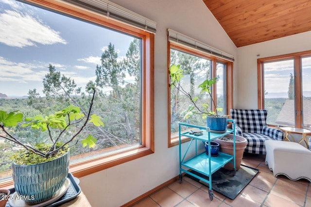 sunroom featuring lofted ceiling and wood ceiling