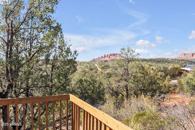 property view of mountains featuring a view of trees