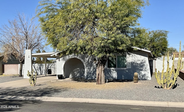 view of front of house with a carport