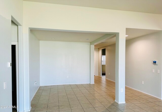 spare room featuring light tile patterned floors