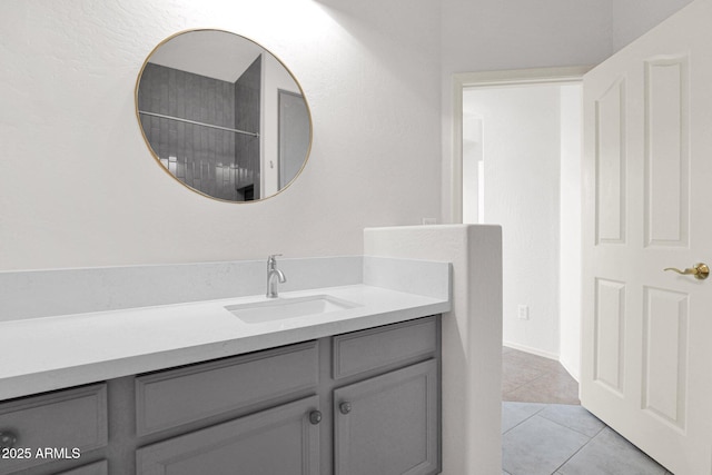 bathroom with tile patterned flooring and vanity