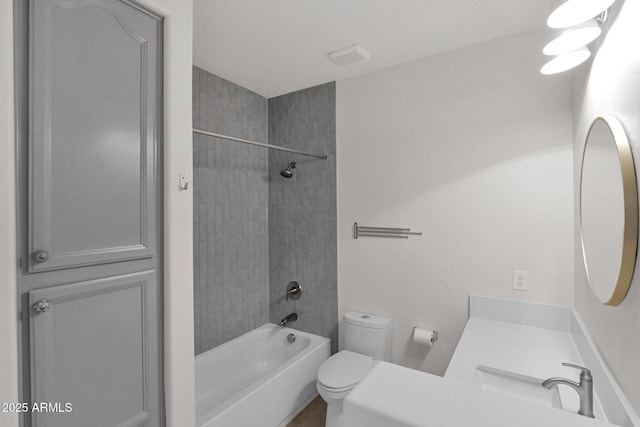 full bathroom featuring bathtub / shower combination, visible vents, vanity, and toilet