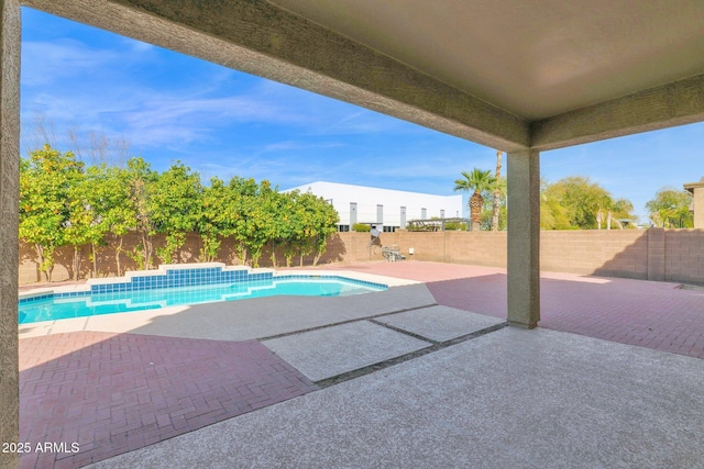 view of swimming pool with a patio area, a fenced backyard, and a fenced in pool