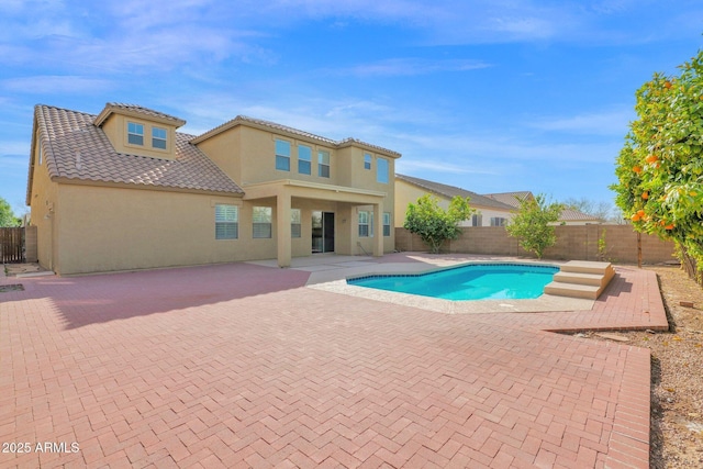 view of pool featuring a fenced backyard, a fenced in pool, and a patio