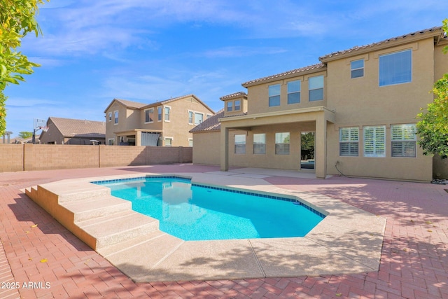 view of swimming pool featuring a residential view, a patio area, a fenced backyard, and a fenced in pool