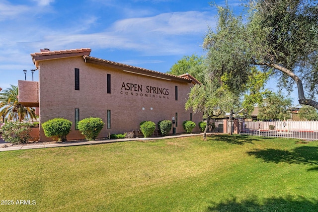 1075 E Chandler Blvd Unit 212, Chandler, AZ 85225 - view of property exterior featuring stucco siding and a tile roof