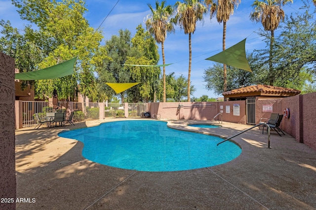 1075 E Chandler Blvd Unit 212, Chandler, AZ 85225 - view of swimming pool featuring a hot tub and a patio area