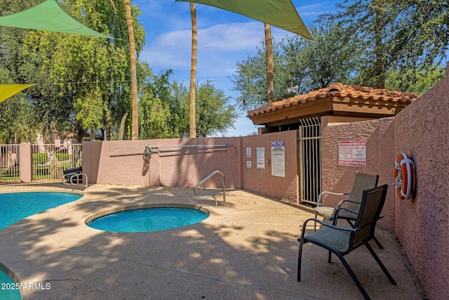 1075 E Chandler Blvd Unit 212, Chandler, AZ 85225 - community pool featuring a patio