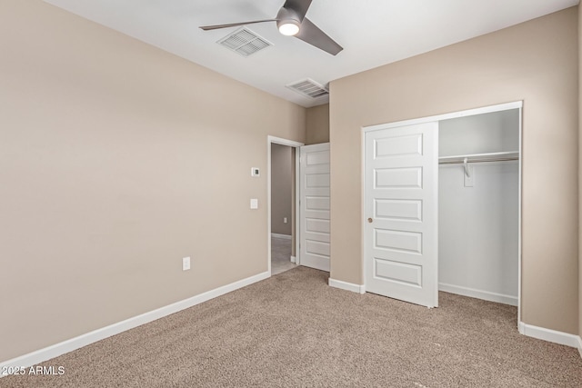 unfurnished bedroom with carpet floors, a ceiling fan, a closet, and visible vents