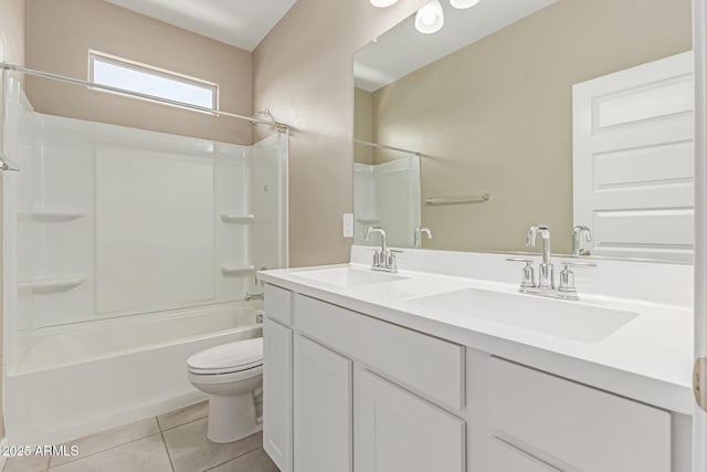 full bathroom with a sink, tile patterned floors, bathtub / shower combination, and toilet