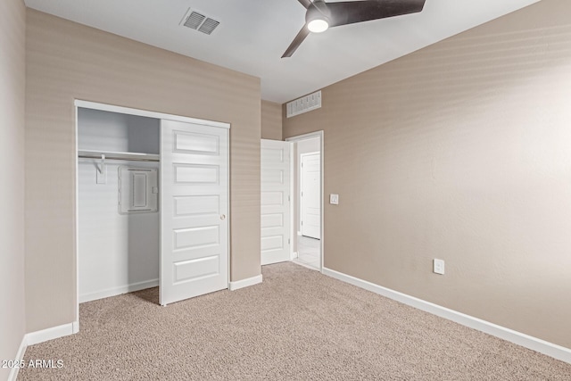 unfurnished bedroom featuring visible vents, carpet flooring, and a closet