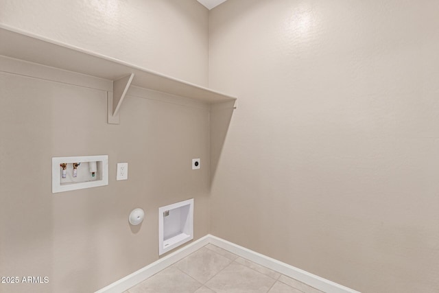 washroom featuring washer hookup, hookup for an electric dryer, laundry area, baseboards, and light tile patterned flooring