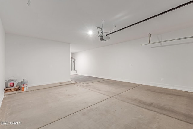 garage featuring baseboards and a garage door opener
