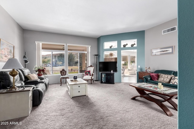 carpeted living room with a wealth of natural light