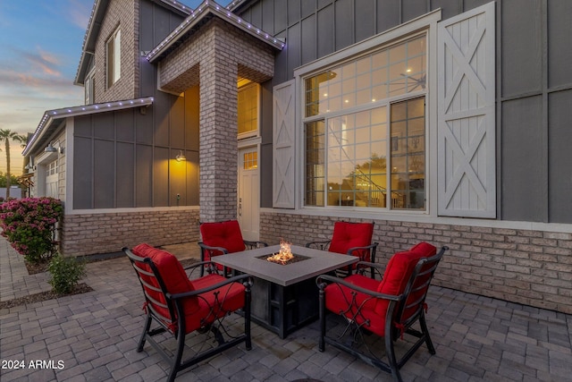 patio terrace at dusk with a fire pit