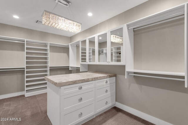 bathroom with tiled shower, vanity, and tile patterned floors