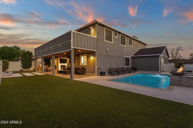 patio terrace at dusk with grilling area and exterior kitchen