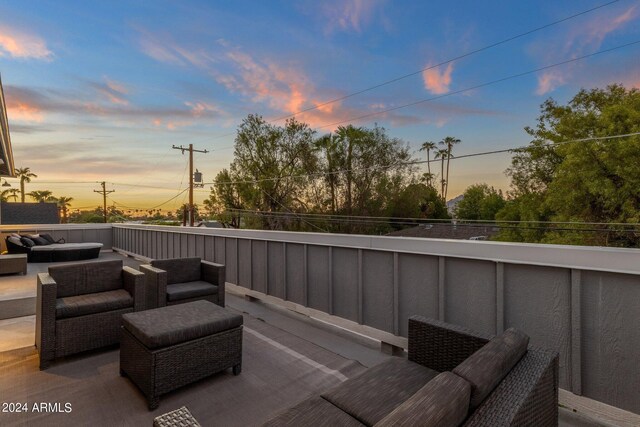 exterior entry at dusk with a hot tub, a patio area, and french doors