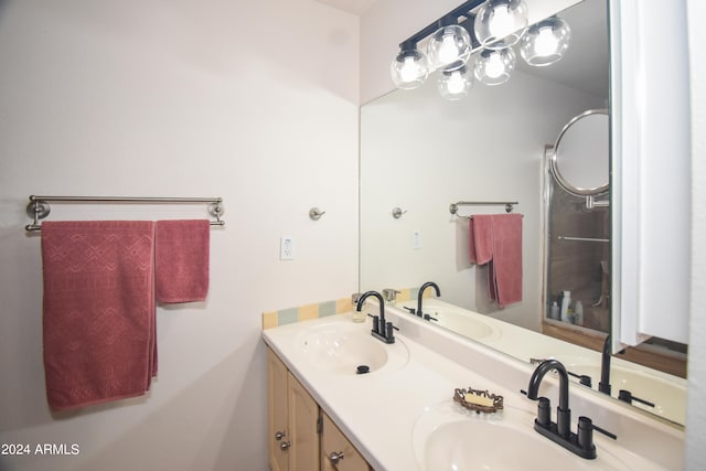 bathroom with oversized vanity and double sink