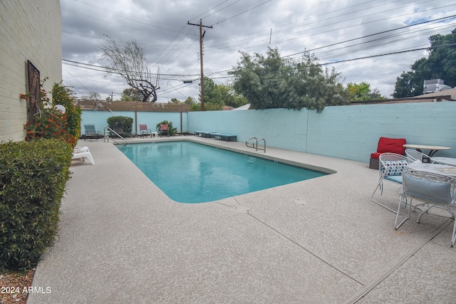 view of pool featuring a patio area