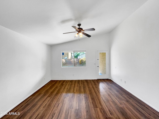 spare room with lofted ceiling, ceiling fan, and dark hardwood / wood-style floors