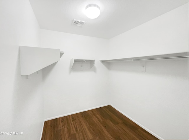 spacious closet featuring hardwood / wood-style flooring