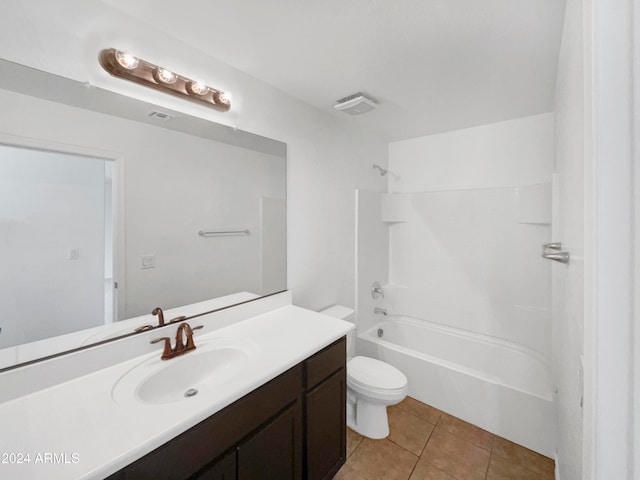 full bathroom with tile patterned floors, vanity, shower / tub combination, and toilet