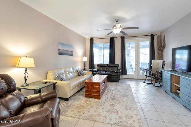 living area with ceiling fan and light tile patterned floors