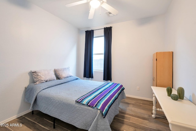 bedroom featuring a ceiling fan, baseboards, visible vents, and dark wood-type flooring