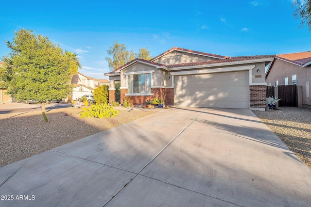 ranch-style home with a garage, driveway, brick siding, and stucco siding