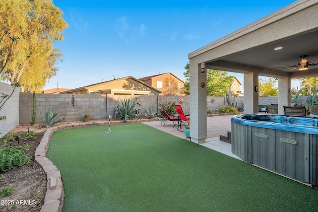 view of yard with ceiling fan, a patio area, and a fenced backyard