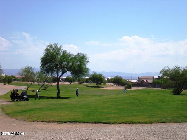 view of home's community featuring a yard