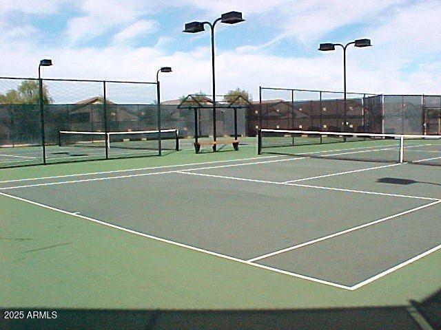 view of sport court with fence