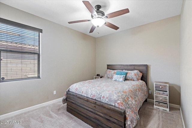 bedroom featuring ceiling fan, baseboards, and carpet