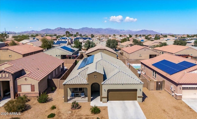 birds eye view of property with a mountain view and a residential view