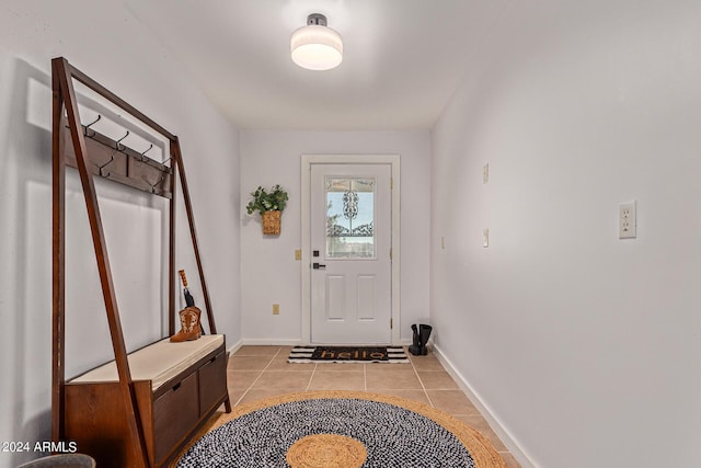 entryway with light tile patterned floors