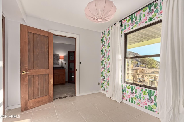 1060 S Kellis Rd, Wickenburg, AZ 85390 - unfurnished room featuring baseboards and light tile patterned flooring