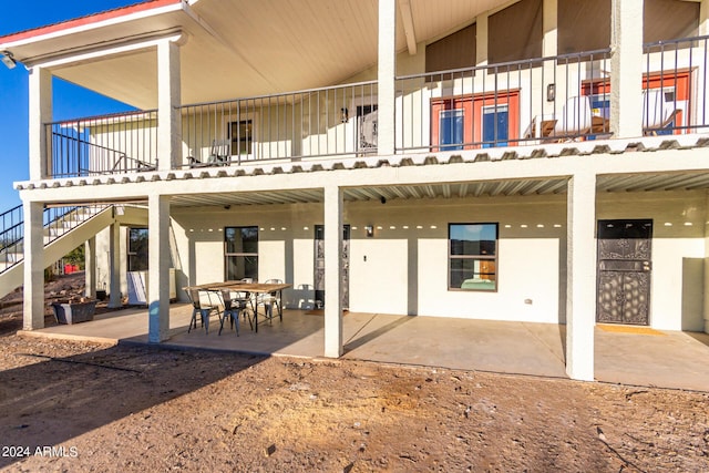 back of property featuring a patio area