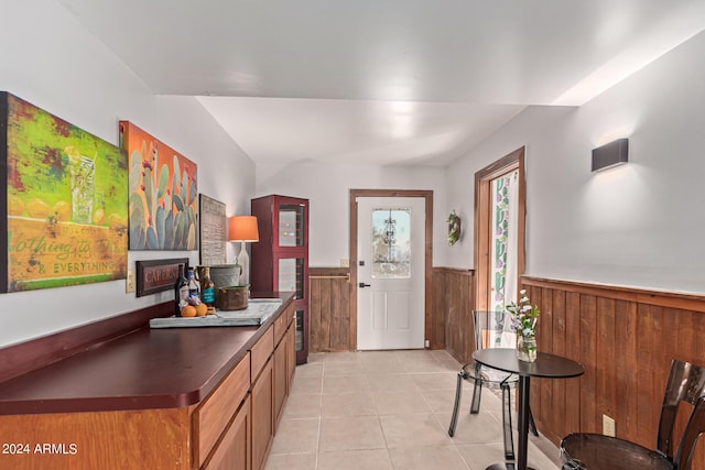 1060 S Kellis Rd, Wickenburg, AZ 85390 - foyer entrance with wainscoting, light tile patterned flooring, and wooden walls