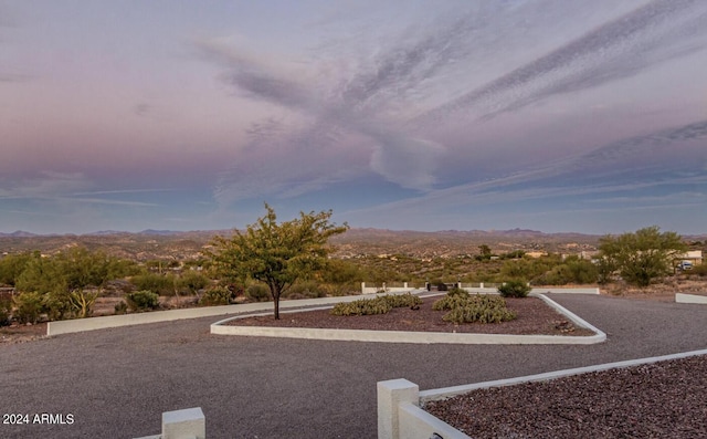 yard at dusk with a mountain view