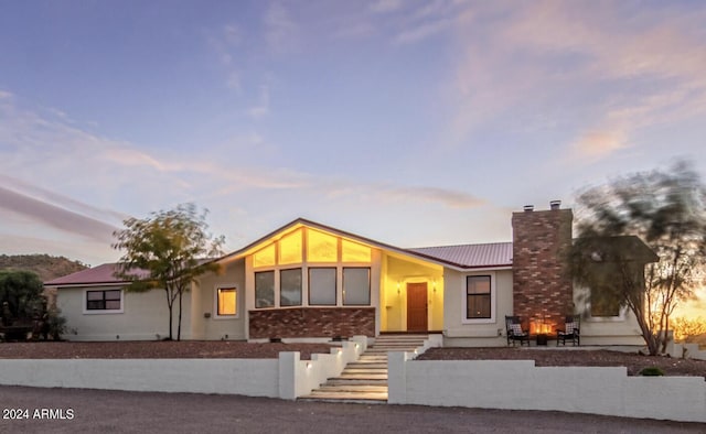 1060 S Kellis Rd, Wickenburg, AZ 85390 - view of front of property with a chimney, a metal roof, and brick siding