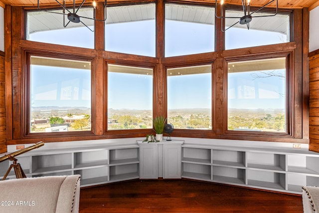 sunroom featuring vaulted ceiling with beams, a wealth of natural light, and wood ceiling